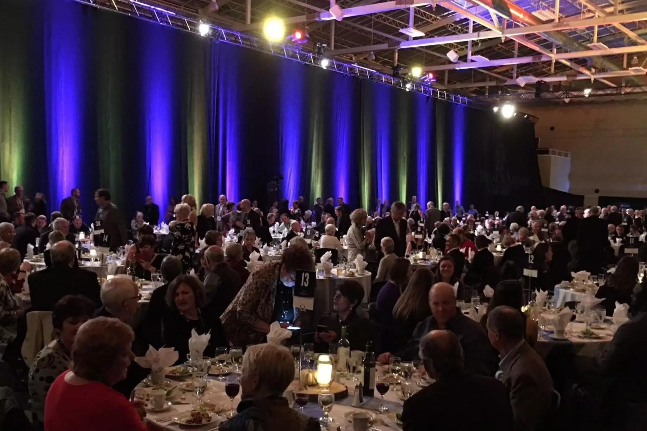 People sitting at round tables in the Keating Centre
