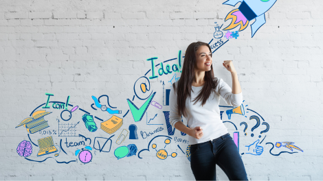 Student exploring entrepreneurship as part of a business administration degree, standing in front of a wall filled with creative business-themed illustrations and motivational words.
