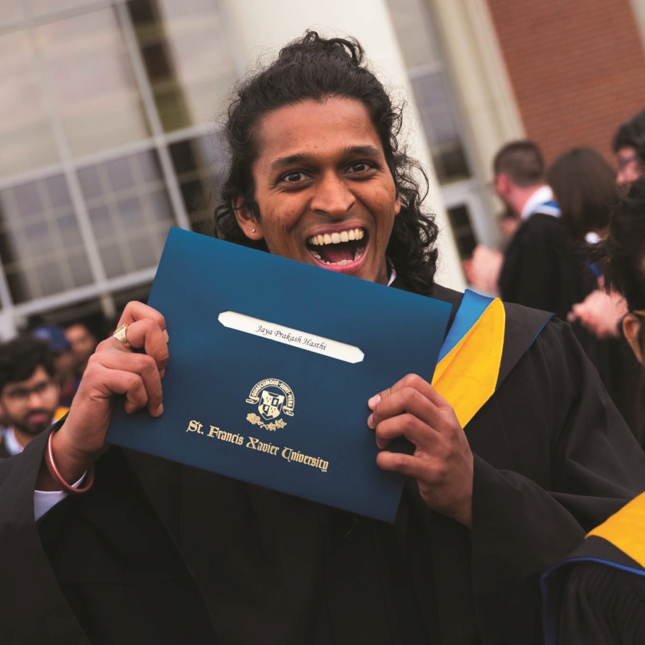 Student at Convocation with a degree