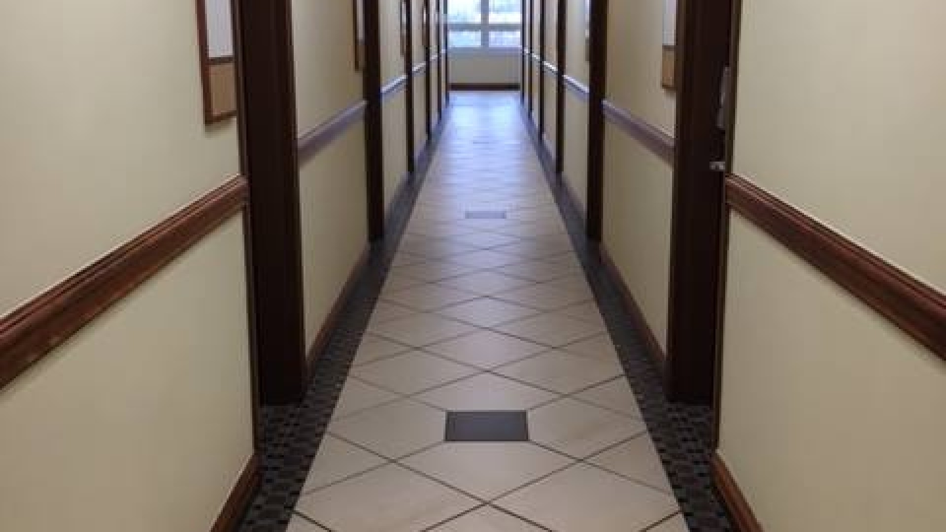 Hallway with dorm rooms along each side 