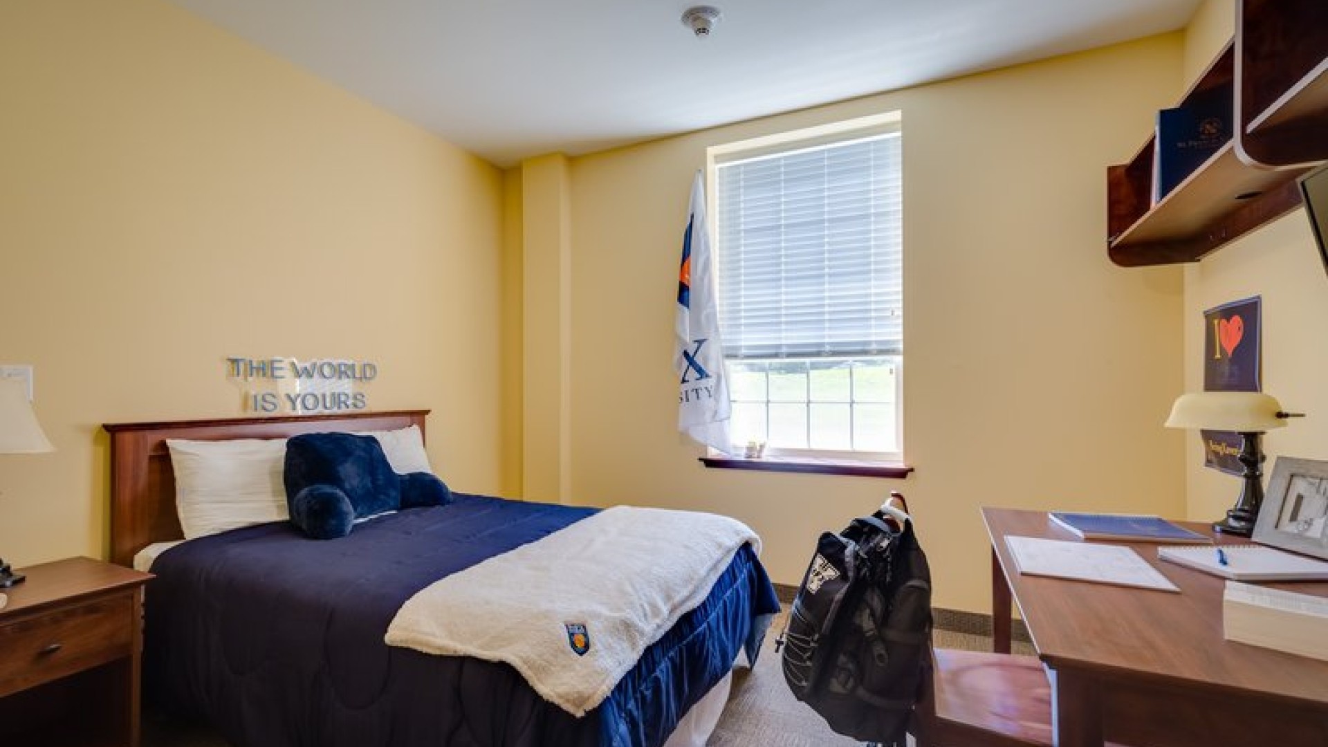 An O'Regan/Riley Single suite showing a double bed, desk, and storage