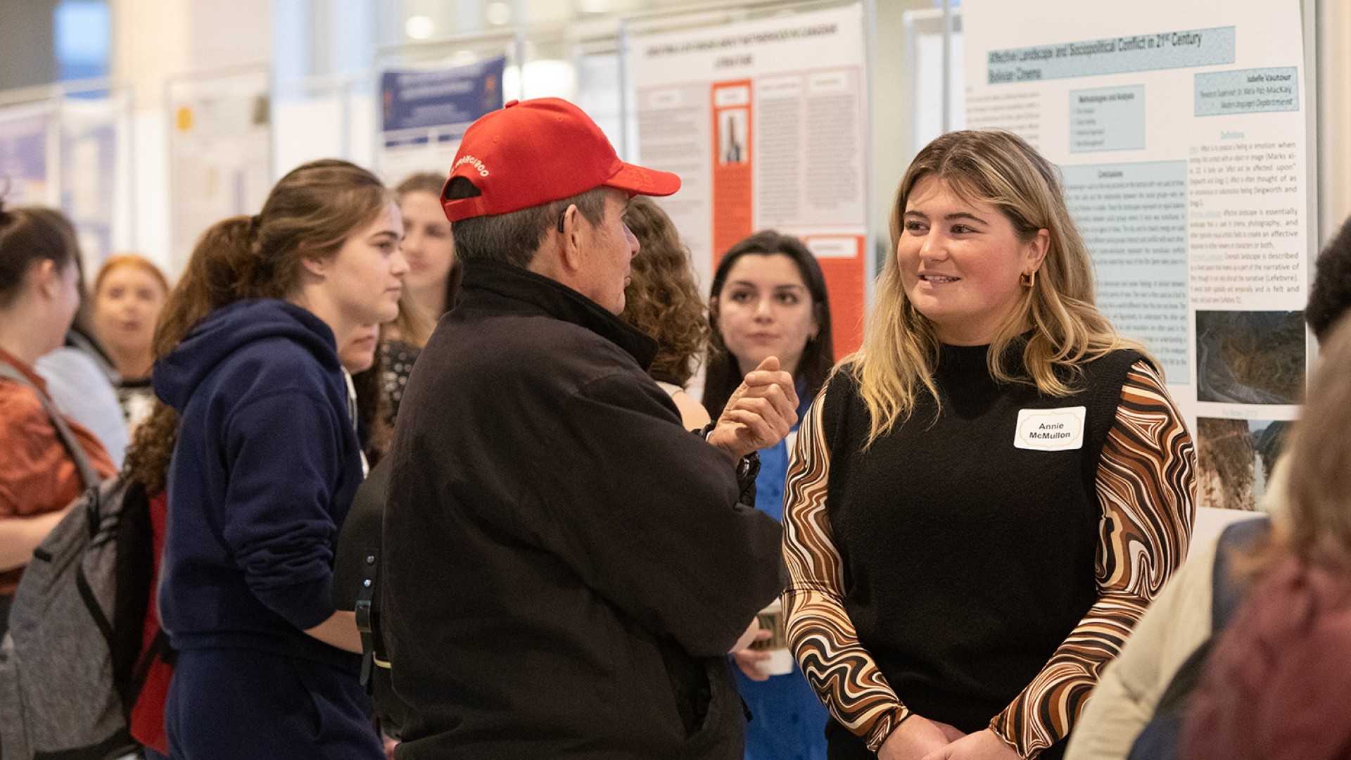 Students talking to each other in a crowd