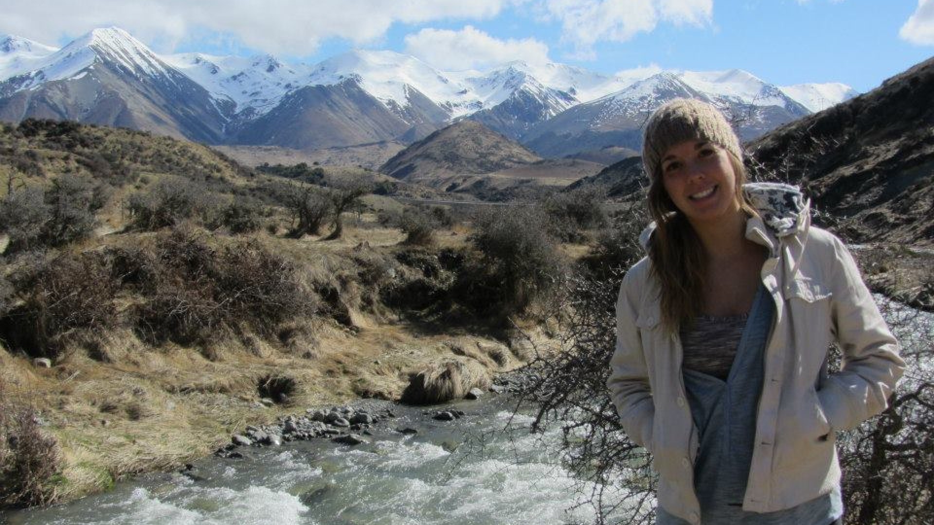 Exchange Student Taking a Picture in a Mountain River