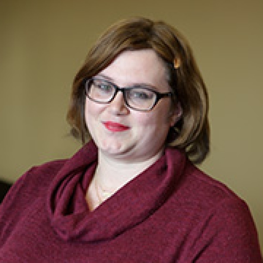 Portrait of person wearing glasses and smiling