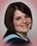 Nicole Heighton with a graduation cap and gown