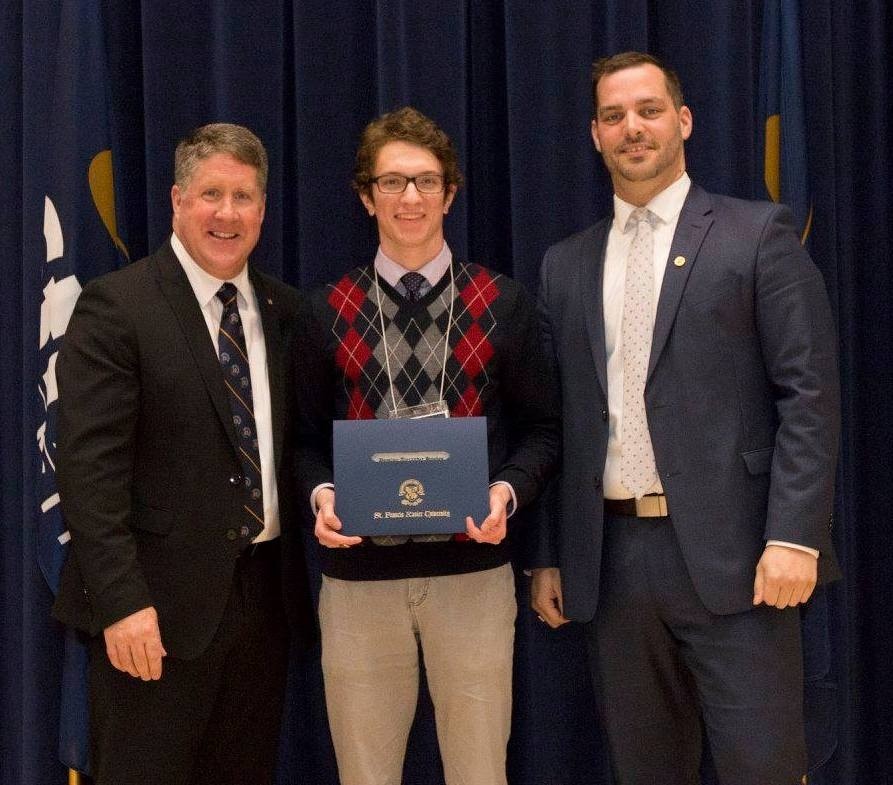Dominic Hughes receives his certificate