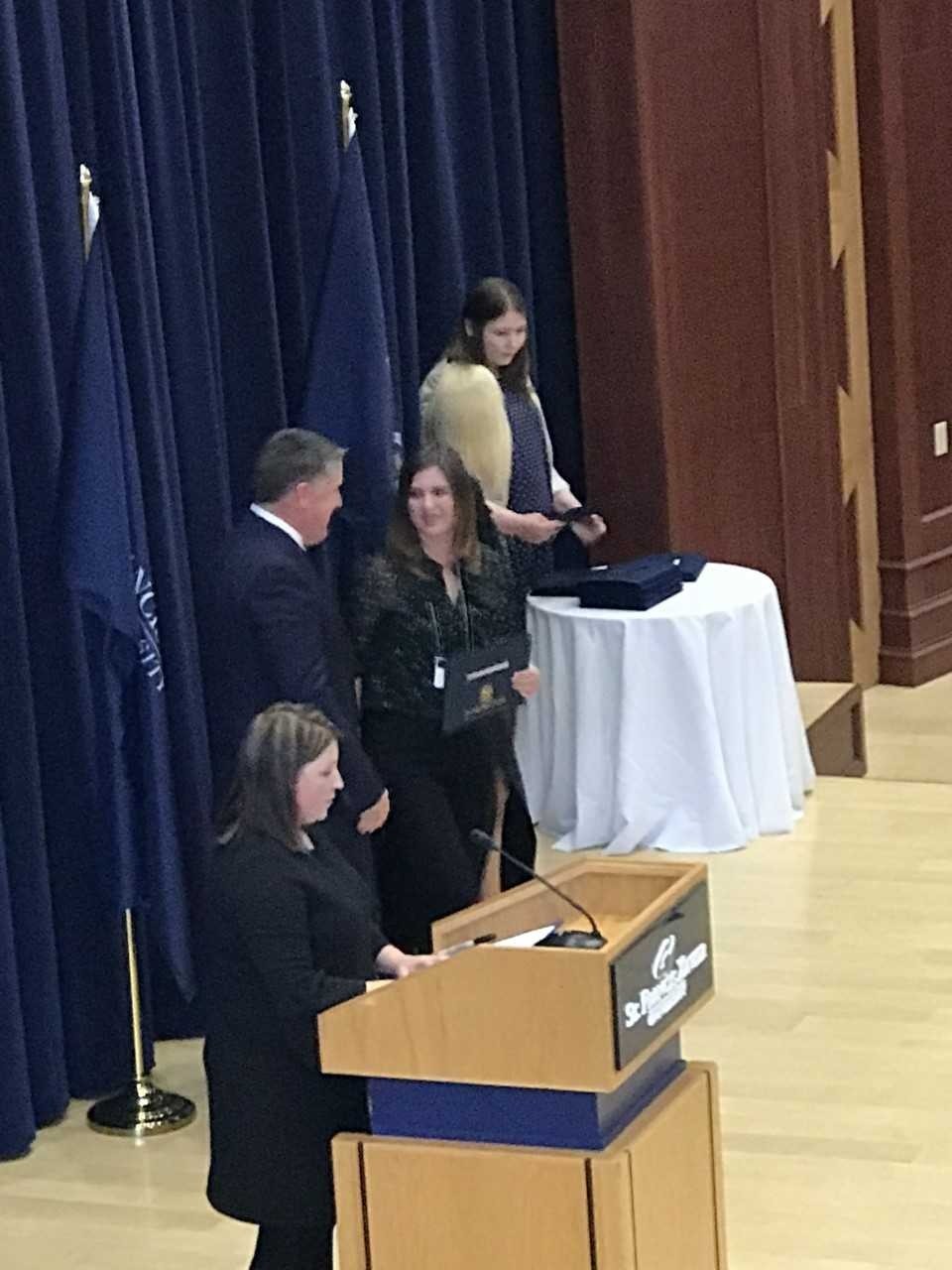 Ms. Natashia Gushue being nducted into The President's Circle of Young Alumni