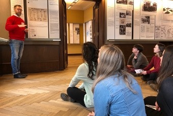 Students listening to lecture in museum