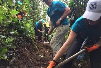 People with shovels gardening