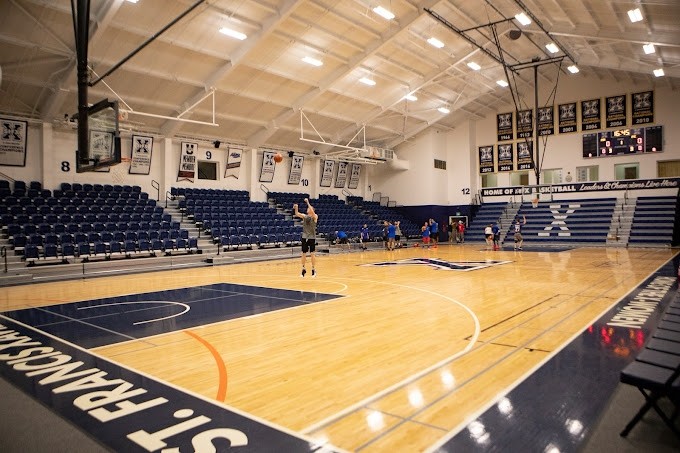 Student shooting a basketball in the Amelia Saputo Centre Gymnasium