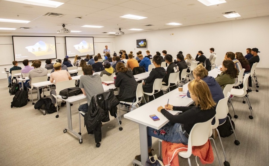 Students sitting behind desks in the classroom