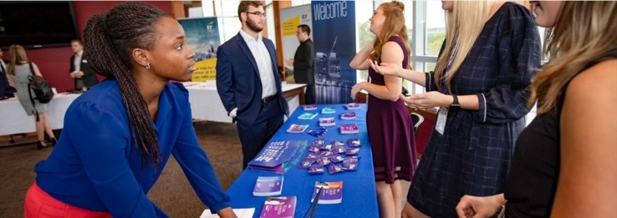 People at a job fair talking to each other