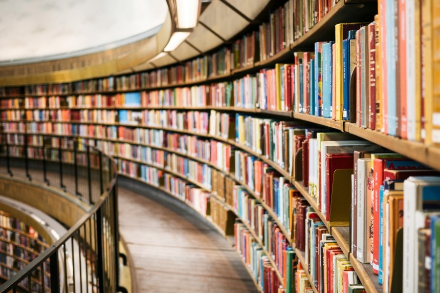Curved shelves of books.