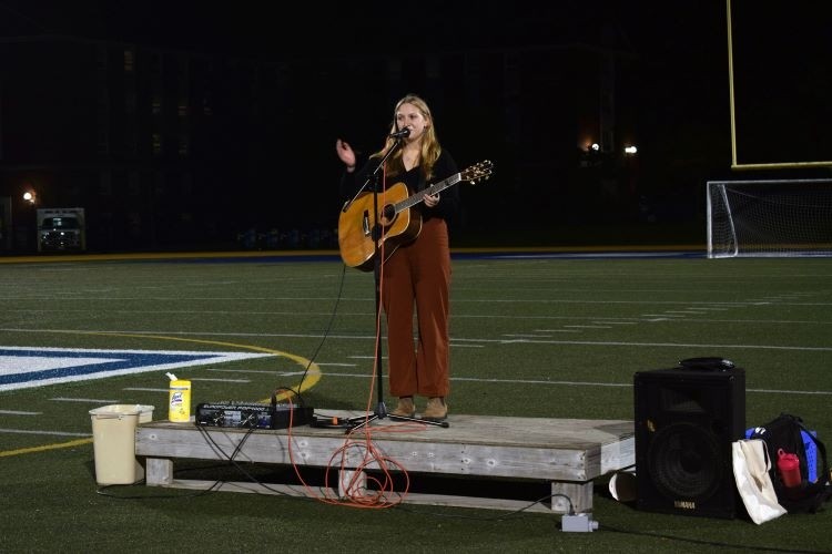 StFX student singing at Take Back the Night 2021