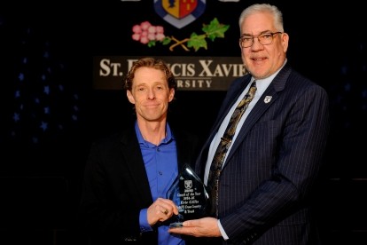 Coach Eric Gillis receiving the 2025 StFX Coach of the Year Award