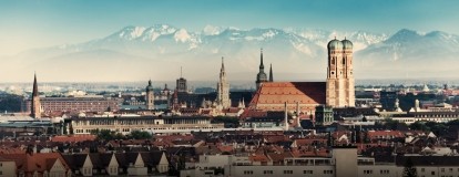A view of a city with mountains in the background.