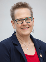 Portrait of person with glasses smiling