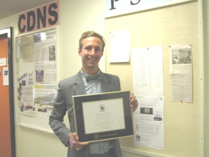 Bridger Kontak showing his diploma