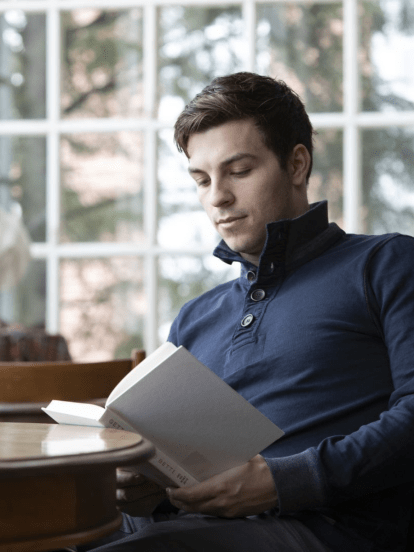 Business student reading a book