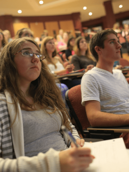 Business students sitting in class in the Schwartz Auditorium